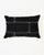 Rectangular black cushion with white stitching on one side